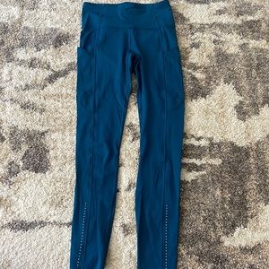 Lululemon size 4 with pockets and raw hem and reflector dots